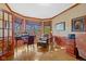 Bright office featuring a bay window, wood trim, and a comfortable seating area at 3608 Olive Branch Rd, Greenwood, IN 46143