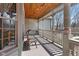 Inviting front porch with a wood ceiling, swing, and cozy seating area at 3608 Olive Branch Rd, Greenwood, IN 46143
