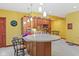 Wet bar with a built-in counter featuring a sink and cabinets, perfect for entertaining guests at 3608 Olive Branch Rd, Greenwood, IN 46143