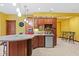 Cozy wet bar area featuring a mini-fridge, sink and built-in cabinets for easy entertaining at 3608 Olive Branch Rd, Greenwood, IN 46143