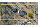 Aerial shot of the property, showing the house, yard, driveway, and surrounding trees at 3905 N Drexel Ave, Indianapolis, IN 46226