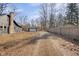 Large backyard featuring a detached garage and wooden privacy fence at 3905 N Drexel Ave, Indianapolis, IN 46226