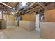 Unfinished basement with concrete floors and walls, exposed pipes, and ample space at 3905 N Drexel Ave, Indianapolis, IN 46226