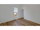 Cozy bedroom with hardwood floors and a bright window at 3905 N Drexel Ave, Indianapolis, IN 46226