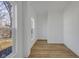 Bright bedroom featuring hardwood floors and neutral walls at 3905 N Drexel Ave, Indianapolis, IN 46226
