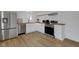 Charming kitchen featuring stainless steel appliances, butcher block countertops, and white cabinetry at 3905 N Drexel Ave, Indianapolis, IN 46226