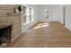 Bright living room with light wood floors and a stone fireplace at 3905 N Drexel Ave, Indianapolis, IN 46226
