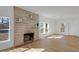 Bright living room with light wood floors and a stone fireplace at 3905 N Drexel Ave, Indianapolis, IN 46226