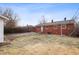 Spacious backyard of a brick home, perfect for relaxation and outdoor entertaining with grassy lawn at 4013 Priscilla Ave, Indianapolis, IN 46226