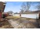 Large backyard with a detached two-car garage and concrete driveway, offering ample outdoor space at 4013 Priscilla Ave, Indianapolis, IN 46226