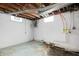 Unfinished basement with painted walls, exposed ceiling, and small windows at 4013 Priscilla Ave, Indianapolis, IN 46226