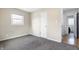 Bedroom featuring carpeted floors and window allowing for natural light at 4013 Priscilla Ave, Indianapolis, IN 46226