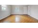 Neutral bedroom with parquet flooring, white walls and ample natural light ready to be transformed at 4013 Priscilla Ave, Indianapolis, IN 46226