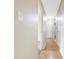 Hallway featuring hardwood floors with neutral walls, and lighting overhead at 4013 Priscilla Ave, Indianapolis, IN 46226