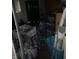 A cluttered room filled with stacks of water bottles and containers at 4718 W 36Th St, Indianapolis, IN 46222