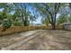 Large backyard featuring a wooden fence, offering ample space and privacy for various outdoor uses and landscaping at 516 N Chester Ave, Indianapolis, IN 46201