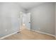Open bedroom with laminate flooring and neutral paint, offering versatility and room to personalize at 516 N Chester Ave, Indianapolis, IN 46201