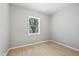 Cozy bedroom featuring neutral paint and a window offering natural light and a serene atmosphere at 516 N Chester Ave, Indianapolis, IN 46201