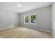 Bright, airy bedroom with light wood flooring and natural light at 516 N Chester Ave, Indianapolis, IN 46201
