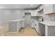 Updated kitchen showcasing white cabinetry, modern countertops, and stainless steel faucet at 516 N Chester Ave, Indianapolis, IN 46201