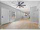 Open-concept living space featuring views of the front entrance and kitchen area at 516 N Chester Ave, Indianapolis, IN 46201