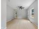 Spacious living room with ample natural light and modern ceiling fan fixture at 516 N Chester Ave, Indianapolis, IN 46201