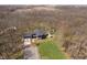 Aerial view of modern home surrounded by mature trees and green yard at 534 1/2 Amos Dr, Zionsville, IN 46077