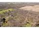 The aerial image captures the property’s expanse, blending a home with its natural wooded background at 534 1/2 Amos Dr, Zionsville, IN 46077