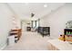 Large and versatile bedroom with a crib, play area, and changing table at 534 1/2 Amos Dr, Zionsville, IN 46077