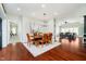 Open concept dining room with hardwood floors that leads into the living room at 534 1/2 Amos Dr, Zionsville, IN 46077