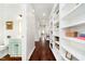 Hallway leading to other parts of the home, featuring built-in bookcases at 534 1/2 Amos Dr, Zionsville, IN 46077