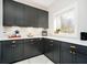 Charming kitchen with custom cabinets, quartz counters, and stainless steel appliances at 534 1/2 Amos Dr, Zionsville, IN 46077