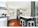 Bright kitchen boasts a large island with seating, stainless steel appliances, and hardwood floors at 534 1/2 Amos Dr, Zionsville, IN 46077