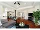 Open concept living room with hardwood floors, seamlessly connected to the kitchen and dining area at 534 1/2 Amos Dr, Zionsville, IN 46077