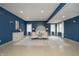 Spacious main bedroom with blue walls, sitting area, and light-colored furniture at 534 1/2 Amos Dr, Zionsville, IN 46077