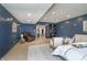 Spacious main bedroom featuring sitting area, blue walls, and an open design at 534 1/2 Amos Dr, Zionsville, IN 46077