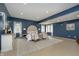 Charming main bedroom featuring stylish decor, blue walls, and a seating area at 534 1/2 Amos Dr, Zionsville, IN 46077