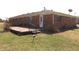 Brick house with wooden deck and grassy backyard at 5582 E State Road 144, Mooresville, IN 46158