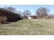 Spacious backyard with a red brick home and a detached garage at 5582 E State Road 144, Mooresville, IN 46158