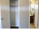 View from closet of bathroom with vanity, mirror, and decorative lighting at 5582 E State Road 144, Mooresville, IN 46158