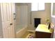 Bright bathroom with tub, shower, and wood vanity at 5582 E State Road 144, Mooresville, IN 46158