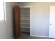 Bedroom closet with built in shelves, accompanied by a window for natural light at 5582 E State Road 144, Mooresville, IN 46158