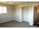 Cozy bedroom featuring a ceiling fan, closet with a hanging rod, and carpet at 5582 E State Road 144, Mooresville, IN 46158