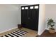 Inviting foyer featuring double doors, tile flooring and a striped rug at 5582 E State Road 144, Mooresville, IN 46158