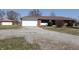 Charming brick ranch with a two-car garage and well-manicured landscaping at 5582 E State Road 144, Mooresville, IN 46158