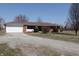 Cozy brick ranch with a well-kept front yard and a welcoming atmosphere at 5582 E State Road 144, Mooresville, IN 46158
