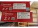 Close-up of boxes of Resolve 5.0 rigid core flooring in Whiskey Barrel color; Made in Vietnam at 5582 E State Road 144, Mooresville, IN 46158