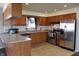 Bright kitchen features tile floors, wooden cabinets, stainless steel appliances, and plenty of counter space at 5582 E State Road 144, Mooresville, IN 46158