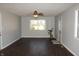 Spacious living room with hardwood floors, neutral paint, and natural light is move-in ready at 5582 E State Road 144, Mooresville, IN 46158