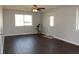 Spacious living room with hardwood floors, neutral paint, and natural light is move-in ready at 5582 E State Road 144, Mooresville, IN 46158